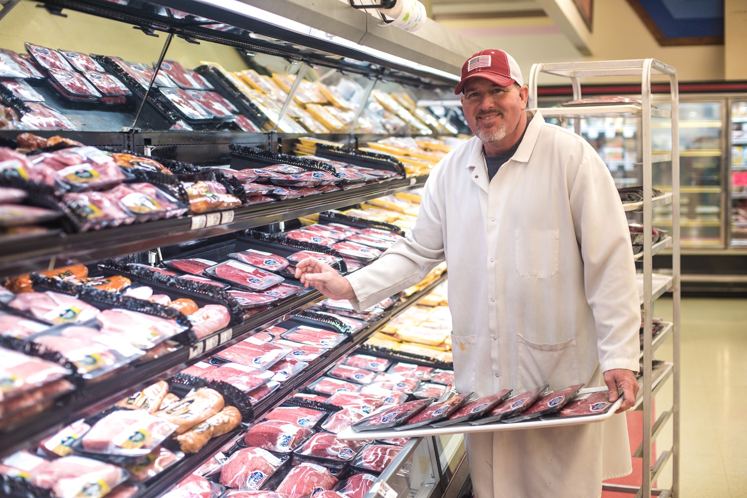 a person preparing food inside of a store